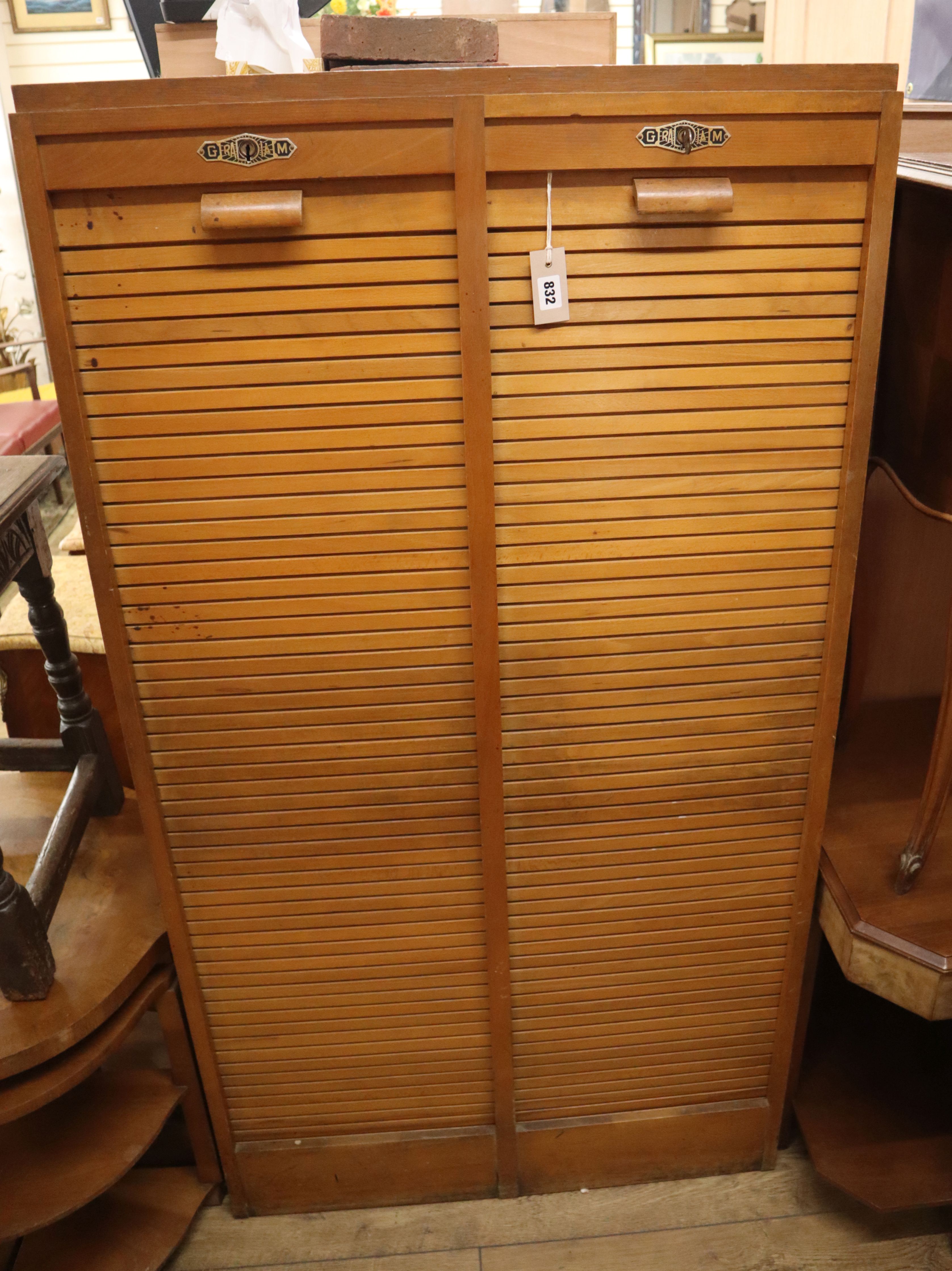 A mid century French double tambour filing cabinet H.150cm