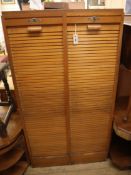 A mid century French double tambour filing cabinet H.150cm