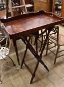 A Victorian mahogany butler's tray on folding stand Tray 77cm