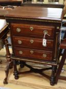 A small 19th century Continental mahogany and parcelgilt three drawer chest with X stretcher H.86cm