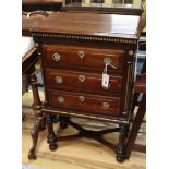 A small 19th century Continental mahogany and parcelgilt three drawer chest with X stretcher H.86cm