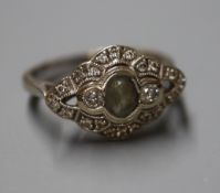 A 750 white metal, aquamarine and diamond set lozenge shaped ring, size K.