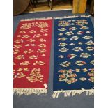 A pair of floral flatweave rugs 180 x 90cm