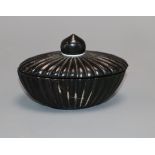 An Indian pot and cover
