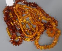 Six amber and amber-style bead necklaces.