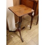 An early 19th century mahogany pedestal on carved fluted tapered column and tripod base (