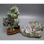 A Chinese jadeite 'dragon' carving and a jadeite group largest 21cm