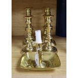 A Victorian brass chamberstick and three pairs of candlesticks