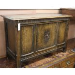 A 1920's panelled oak coffer W.92cm