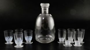 A Rene Lalique Dampierre pattern carafe and six glasses with moulded bands of birds and three