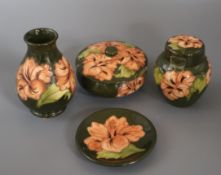 A Moorcroft hibiscus vase, two lidded jars and a pin dish vase 14cm