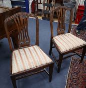 A set eight Hepplewhite style mahogany dining chairs (two with arms)