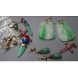 A pair of 14K gold and jade drop earrings, a pair of 9K gold and carved jade earrings and