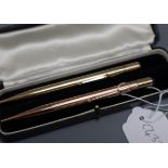 A 9ct gold cased pencil and one other yellow metal case pencil