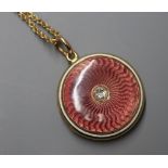 An early 20th century, yellow metal, diamond set enamelled gold locket on a later 10k chain,