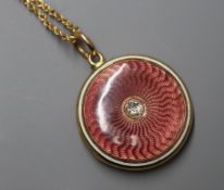 An early 20th century, yellow metal, diamond set enamelled gold locket on a later 10k chain,