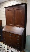 A George III mahogany bureau cabinet previously owned by George Bradshaw author of Bradshaw's