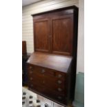 A George III mahogany bureau cabinet previously owned by George Bradshaw author of Bradshaw's