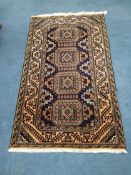 A Belouch style rug 146 x 85cm