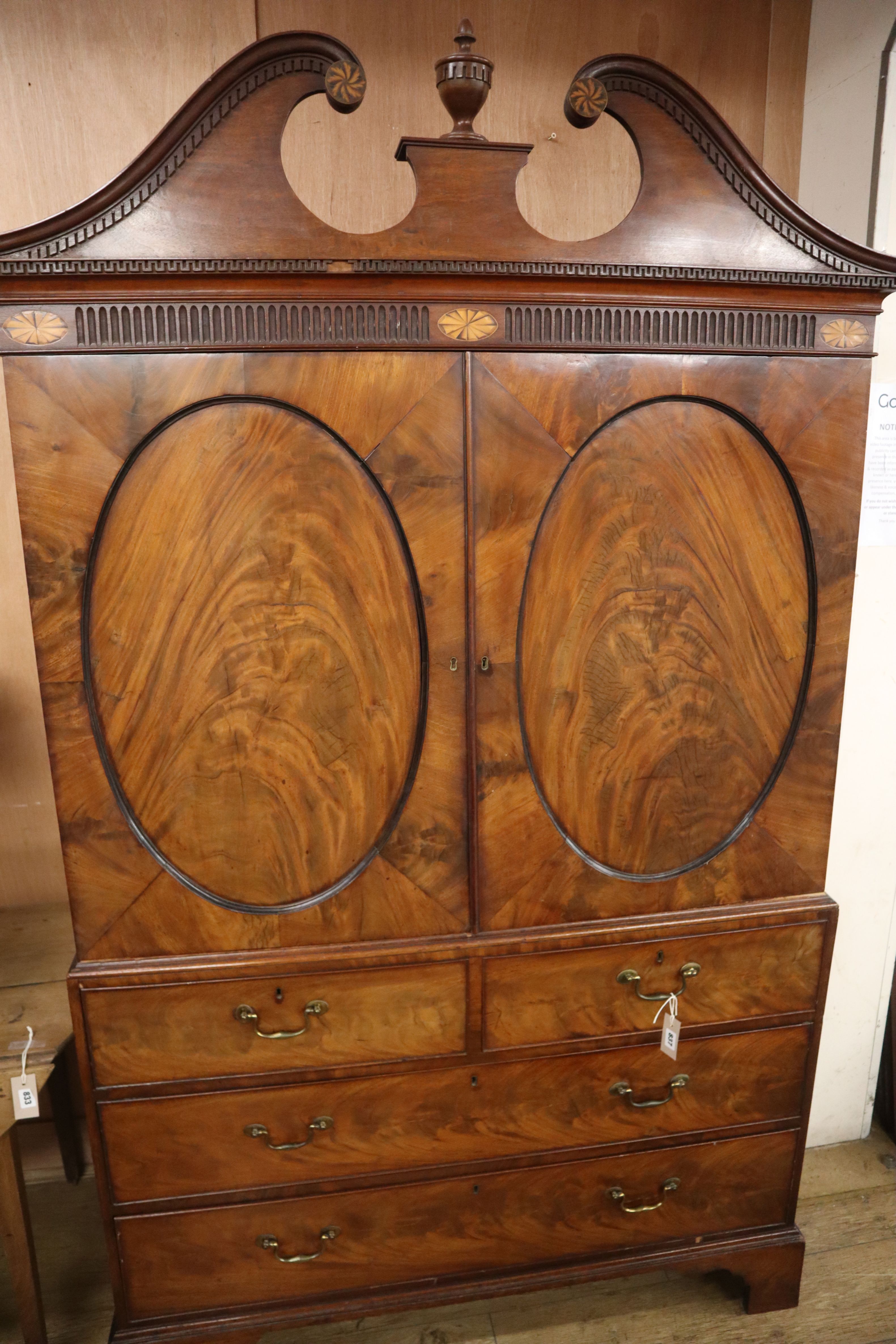 A George III Channel Islands style mahogany linen press, converted to a hanging wardrobe W.128cm