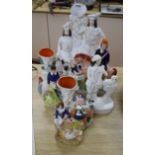 A collection of seven Victorian and later Staffordshire figures and vases