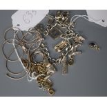 A white metal charm bracelet with 13 charms, an Armani negligee necklace and five other items of