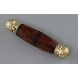 A Victorian engraved yellow metal mounted double ended facet cut ruby glass scent bottle, the