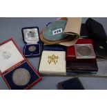 A collection of medals, coins etc