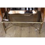 A Maison Jansen style brass and glass coffee table W.89cm