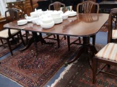 A Regency mahogany twin pedestal extending dining table, with one leaf W.173cm extended