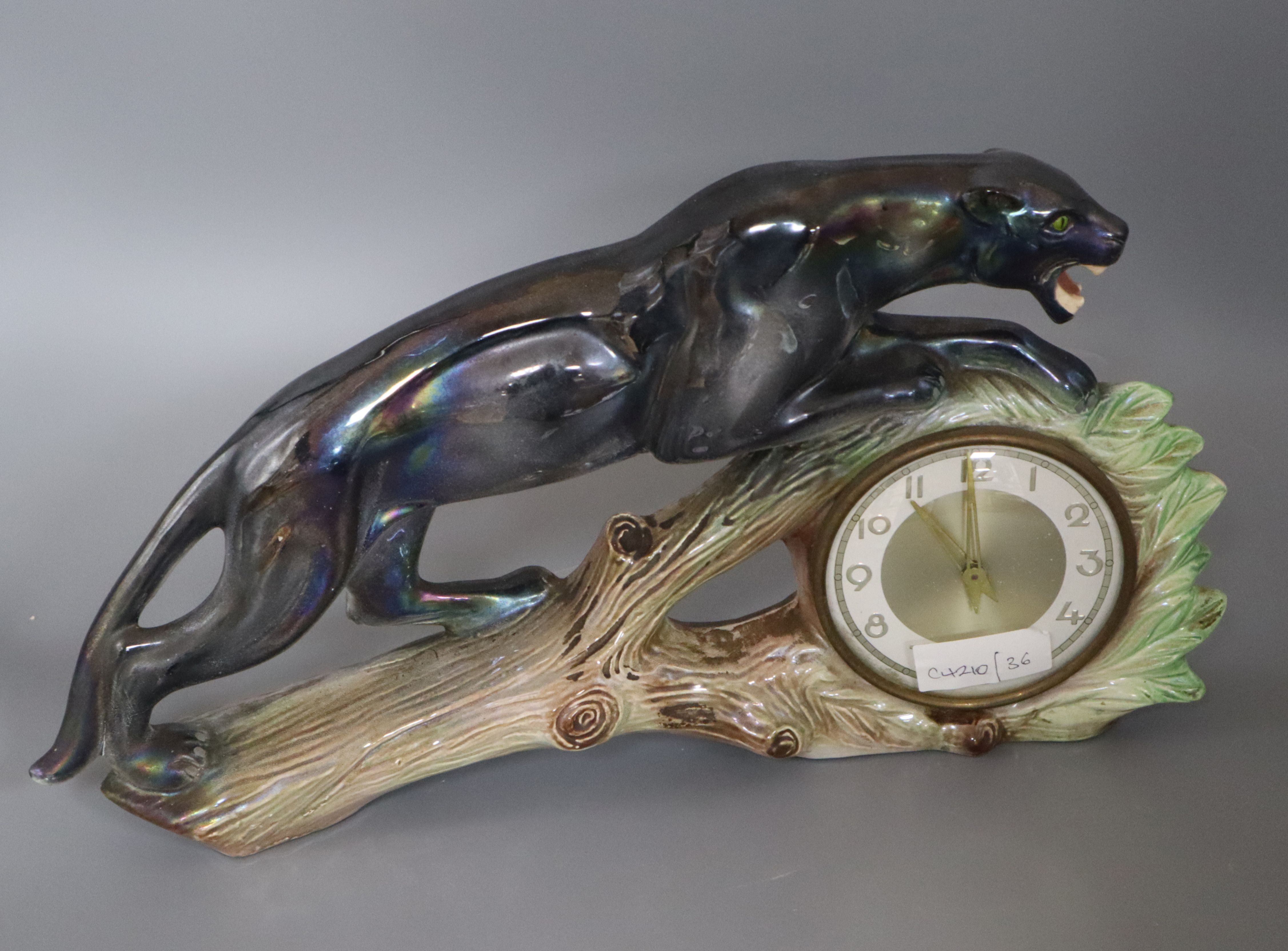 A French ceramic panther mantel timepiece height 23cm