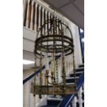 A brass hall lantern of cylindrical form fitted three candle lights, H approx 70cm Dia 37cm