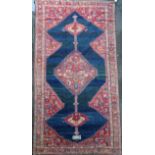 An antique Karabagh carpet, dated 1892, with stepped motifs on a red ground, with three row