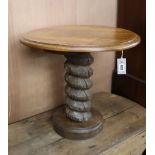 A circular oak occasional table with screw press column Diameter 59cm