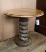 A circular oak occasional table with screw press column Diameter 59cm