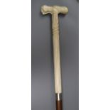 A Portuguese whalebone handled walking stick, the handle pre 1947 length 86cm