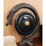 A South-east Asian dinner gong and stand H.85cm