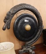 A South-east Asian dinner gong and stand H.85cm