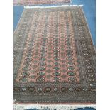 A Bokhara style rug 240 x 155cm