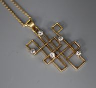 An 18K gold and diamond modernist pendant on 9ct gold flattened link chain, the pendant formed as an