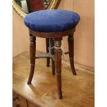 A Regency mahogany adjustable piano stool