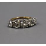 An early 20th century 18ct and plat, graduated five stone old mine cut diamond half hoop ring, the