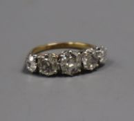 An early 20th century 18ct and plat, graduated five stone old mine cut diamond half hoop ring, the