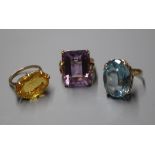 A 9k and citrine dress ring and two other 9ct dress rings.