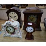 Four assorted wood and ceramic mantel clocks tallest 38cm