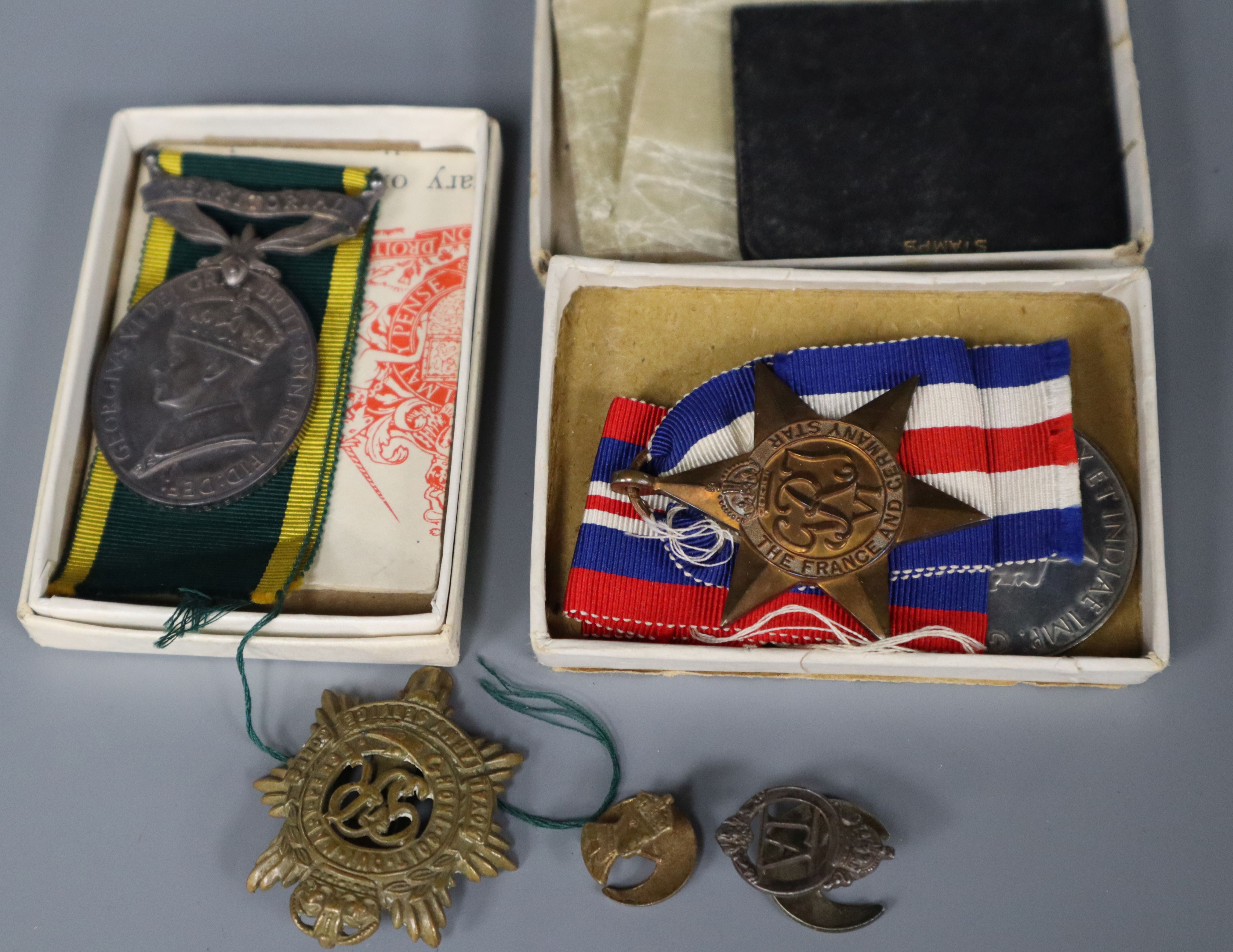 A Territorial Fox Efficiency medal, two WW2 medals and badges etc