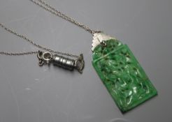 A 1930's white metal mounted pierced jade pendant, on chain, pendant 46mm.