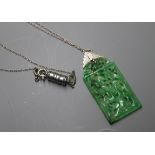 A 1930's white metal mounted pierced jade pendant, on chain, pendant 46mm.