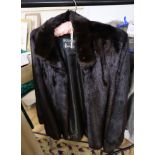 A dark brown mink jacket with a Grosvenor Harrods label