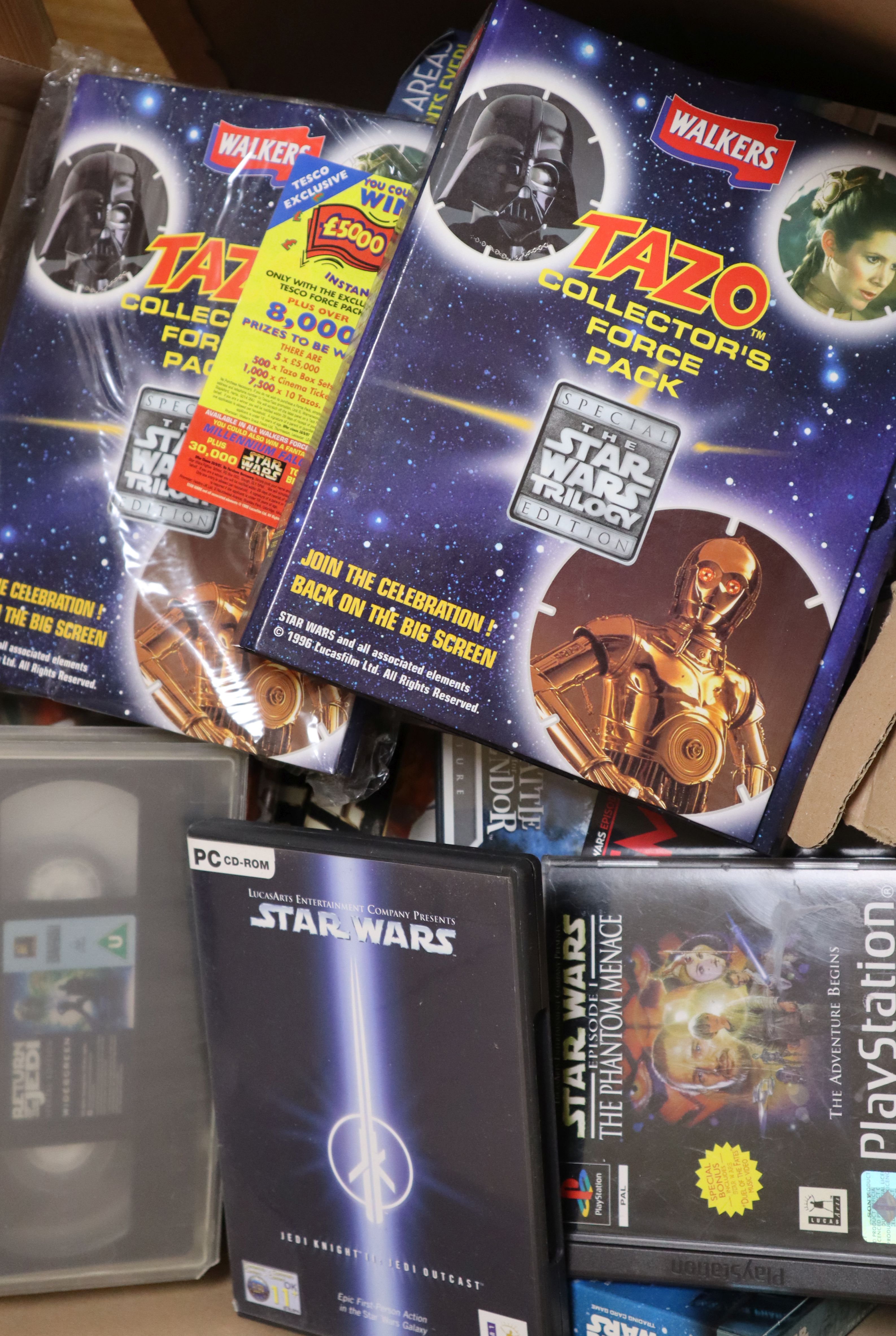 A collection of vintage Star Wars VHS tapes, DVDs, PC/console games etc. see Gorringes website